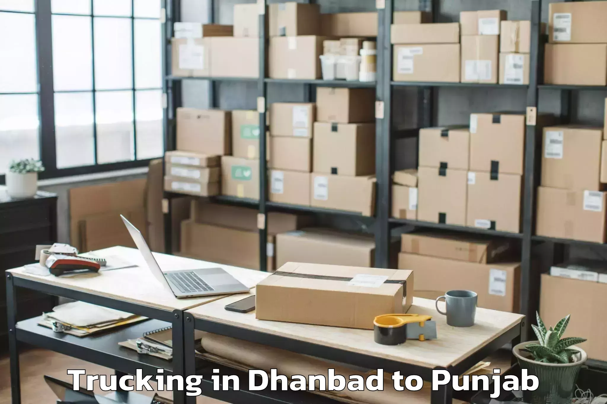 Book Dhanbad to Maharaja Ranjit Singh Punjab T Trucking Online